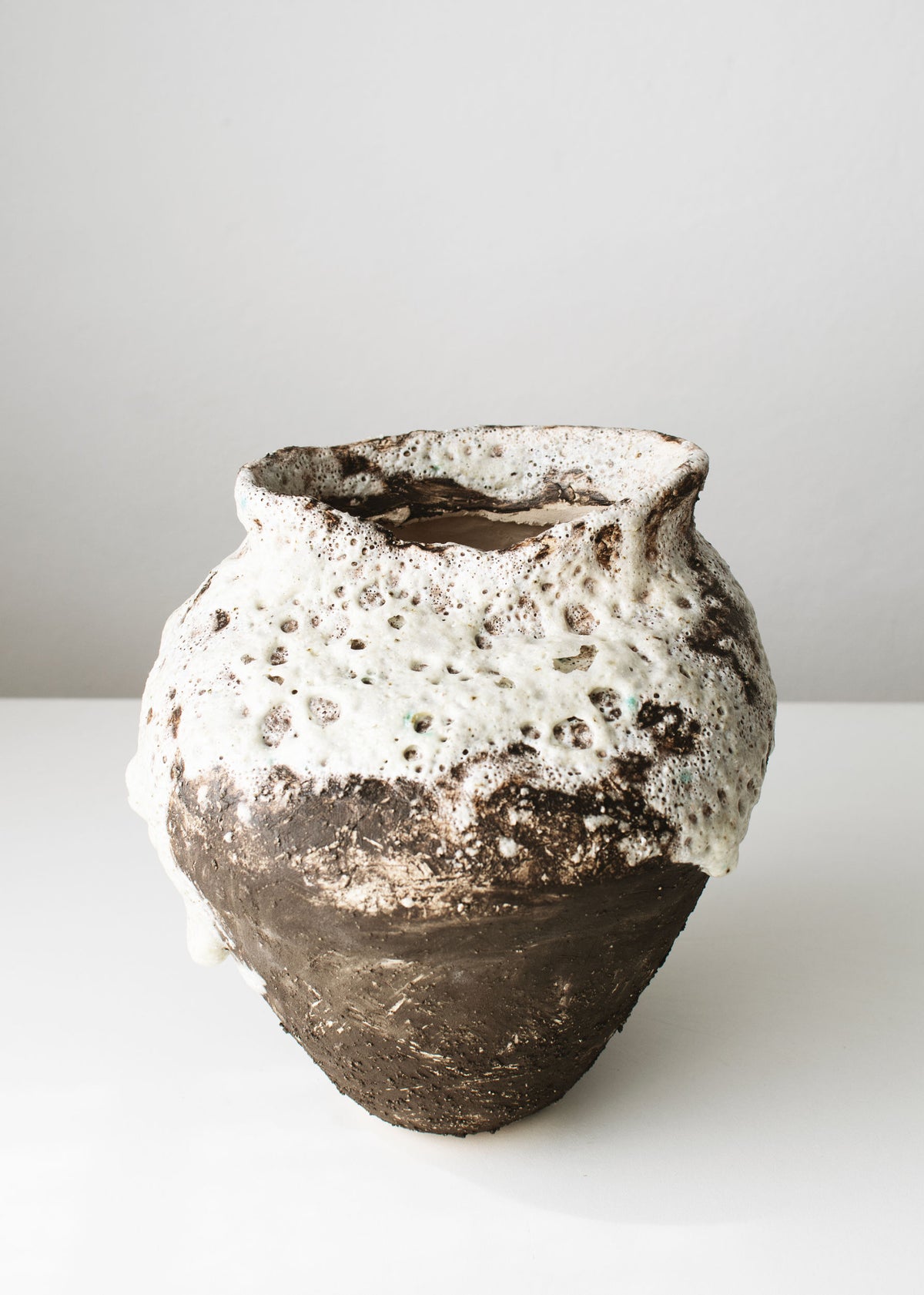 Pocked with White